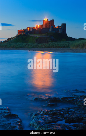 Bamburgh Castle at sunrise on the east coast of Northumberland, England. Stock Photo