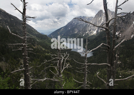 Mirador L'Estany Sant Maurici lake and Els Encantats mountain peak on Pyrenean Traverse National Park Pyrenees Spain Stock Photo