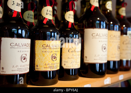 Bottles of Calvados Apple Brandy for sale in French food shop, Deauville, Normandy Stock Photo