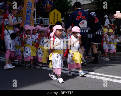 Japanese elementary school children at Nebuta Matsuri summer festival of giant floats, Aomori City, Aomori Prefecture, Japan Stock Photo