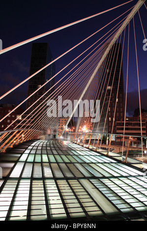 Night image of the Zubizuri bridge across the Nervion River in Bilbao, Spain. Stock Photo