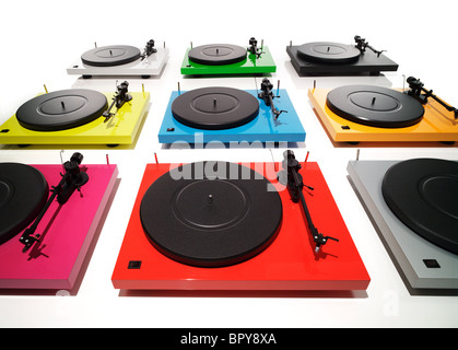 a group shot of pink, red, grey, yellow, blue, orange, black, green, white record players on a white background Stock Photo