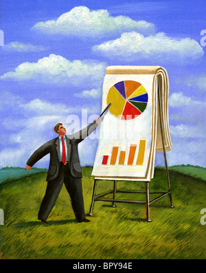 A businessman pointing to a pie chart Stock Photo