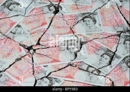 Cracked fifty pound notes concept to represent an economic crisis Stock Photo