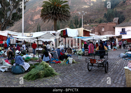 View over stalls in local part of Pisac market in Plaza de Armas, Sacred Valley, near Cusco, Peru Stock Photo