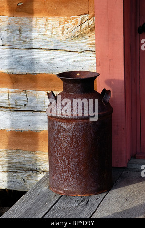 Historic Collinsville Southside Tennessee old antique milk can sitting on wooden porch Stock Photo