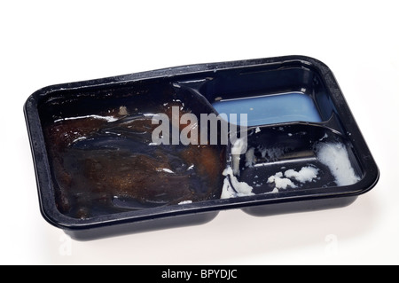 A ready meal tv dinner tray empty, that has been eaten on white background cut out. Stock Photo