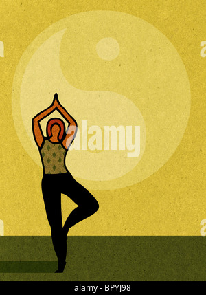 A woman doing yoga and a large ying yang symbol Stock Photo