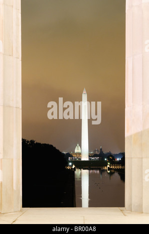 WASHINGTON DC, United States — A nighttime view of the Washington Monument as seen from the Lincoln Memorial, with the illuminated monument beautifully reflected on the still waters of the Reflecting Pool. This iconic scene on the National Mall captures the tranquility and grandeur of Washington DC's landmarks at night. Stock Photo