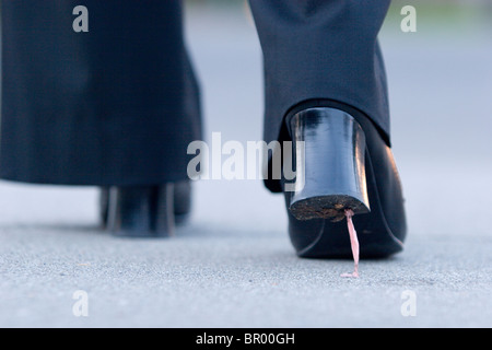 Gum stuck on high heel shoes. Stock Photo