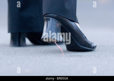 Gum stuck on high heel shoes. Stock Photo