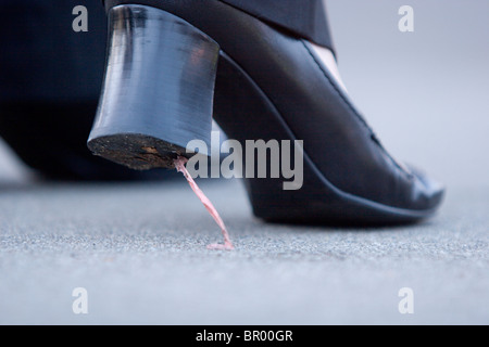 Gum stuck on high heel shoes. Stock Photo