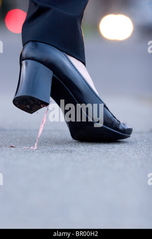 Gum stuck on high heel shoes. Stock Photo