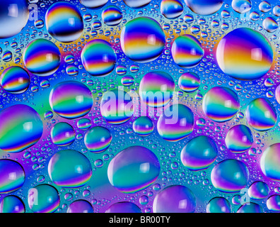 Abstract image of drops of water coloured by cross polarisation. Stock Photo