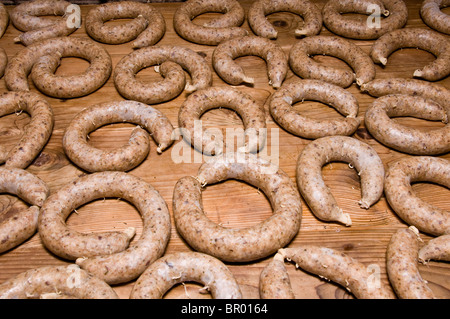 Horizontal view on wooden table full of curly liverwurst Stock Photo