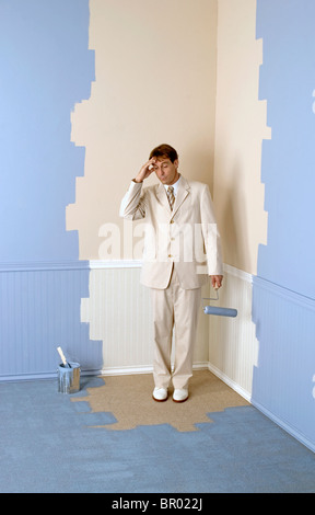 man who has painted himself into a corner Stock Photo
