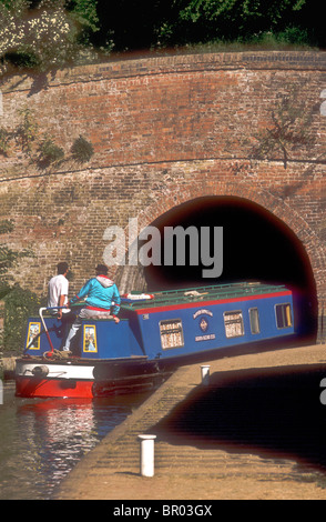 A narrowboat enters the Blisworth canal tunnel at Stoke Bruerne Northamptonshire England UK Stock Photo