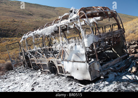 Burnt out bus Stock Photo