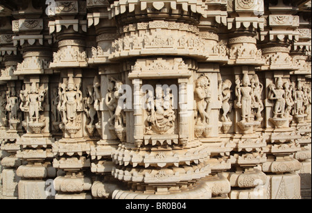 Intricately carved white stone sculptures of gods and creatures covering the Jagdish Hindu temple in Udaipur, Rajasthan. Stock Photo