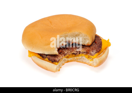 A cheeseburger in bread bun with a bite taken out on white background cutout. Stock Photo