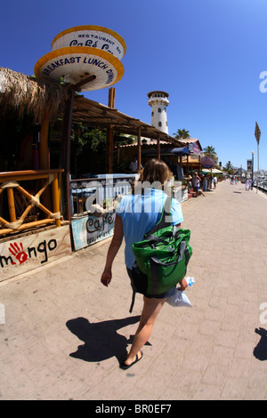 Young woman walks around the harbor area in downtown Cabo San Lucas in Baja, Mexico. Stock Photo