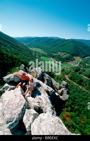 Climbers sign into the summit register atop the South Peak at Seneca Rocks in the Monongahela National Forest, WV. Stock Photo