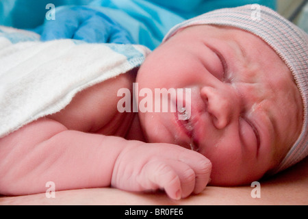 Newborn baby on mother's chest in delivery room immediately after Stock ...