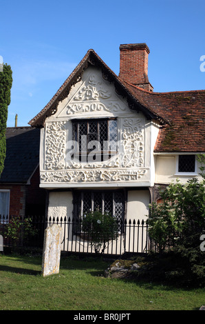 Midsummer evening sunlight highlights pargeting on the Ancient House, Clare, Suffolk. Stock Photo