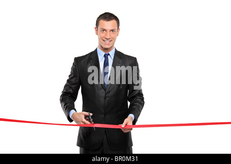 A man cutting a red ribbon, opening ceremony Stock Photo