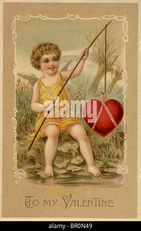 A vintage Valentines Day card with a cupid fishing a heart Stock Photo