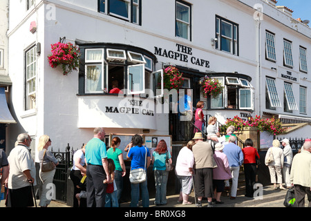Diners queuing outside The Magpie Cafe restaurant, Whitby, North Yorkshire, England, UK. Stock Photo