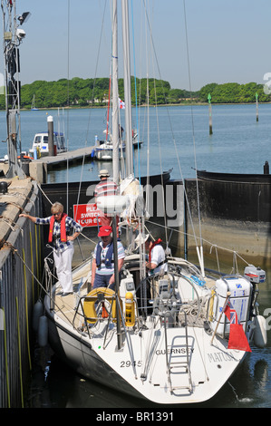 Yacht  going through the lock, from Chichester Marina. Stock Photo