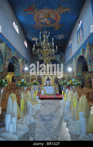 Orthodox wedding interior altar decorated prepared wedding ceremony flower arrangement corridor church religion marriage Christ Stock Photo