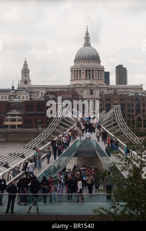St. Paul's Cathedral and the Millennium Bridge as seen from the Tate Modern in London, England in Summer. Stock Photo