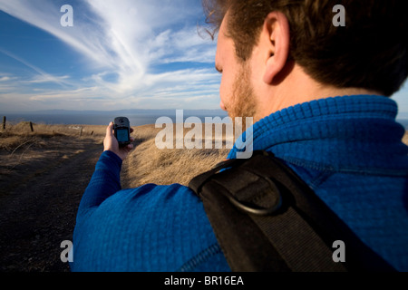 A man hikes on Santa Cruz Island, California. Stock Photo