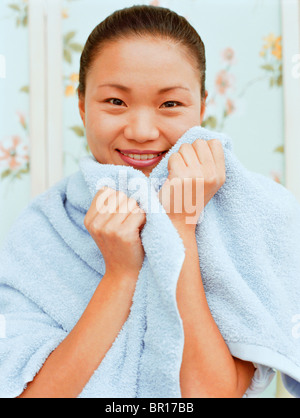 Woman wrapped in towel Stock Photo