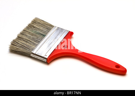 Large paintbrush with a red plastic handle on a white background Stock Photo