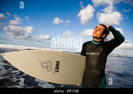 Surfer wading in the water in San Diego, CA. Stock Photo