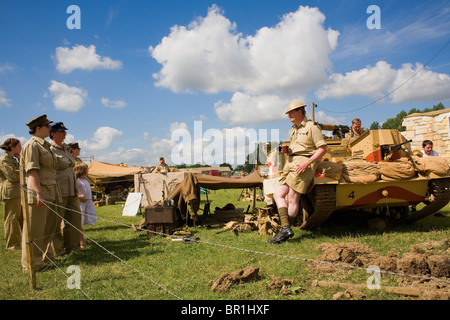 WWII reenactors at the War & Peace Show with a tank. Stock Photo