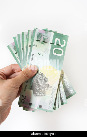 hand holding money canada canadian twenty dollars Stock Photo