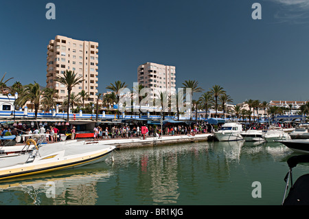 estepona harbour with weekly market in the background Stock Photo