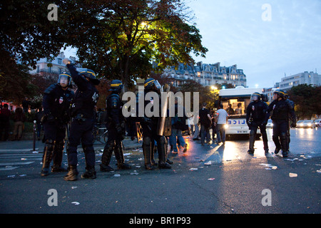 French riot police (CRS) confront protesters, during demonstration over proposed pension reforms, Paris, France, 07/09/10 Stock Photo