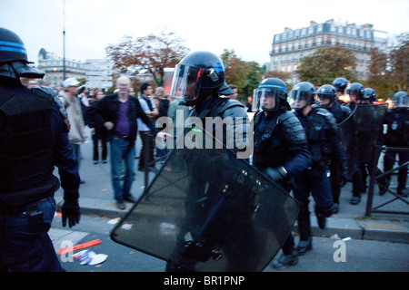 French riot police (CRS) confront protesters, during demonstration over proposed pension reforms, Paris, France, 07/09/10 Stock Photo