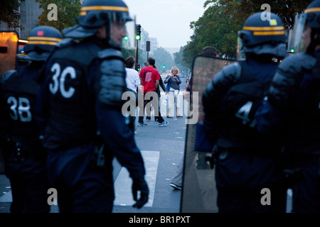 French riot police (CRS) confront protesters, during demonstration over proposed pension reforms, Paris, France, 07/09/10 Stock Photo