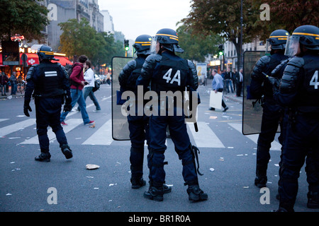 French riot police (CRS) confront protesters, during demonstration over proposed pension reforms, Paris, France, 07/09/10 Stock Photo