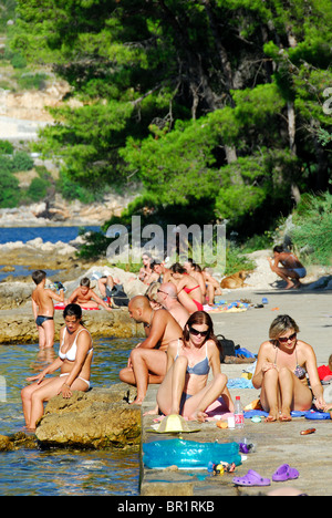 ZATON VELIKI, near DUBROVNIK, CROATIA. Sunbathing at Zaton Bay. Stock Photo