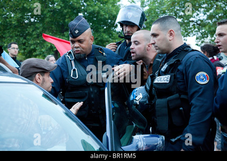 French riot police (CRS) confront protesters, during demonstration over proposed pension reforms, Paris, France, 07/09/10 Stock Photo