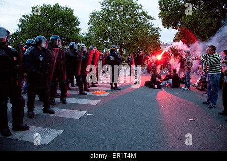 French riot police (CRS) confront protesters, during demonstration over proposed pension reforms, Paris, France, 07/09/10 Stock Photo