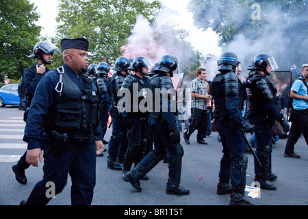 French riot police (CRS) confront protesters, during demonstration over proposed pension reforms, Paris, France, 07/09/10 Stock Photo