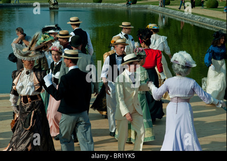 Victorian Women, France - senior people activities, French Couples Dancing, 'Chateau de Breteuil', (Choisel), Dressed in victorian age Period Costume, Fancy Dress, Outside at Village Dance Ball Event retirement pensioners fun, bal france Stock Photo